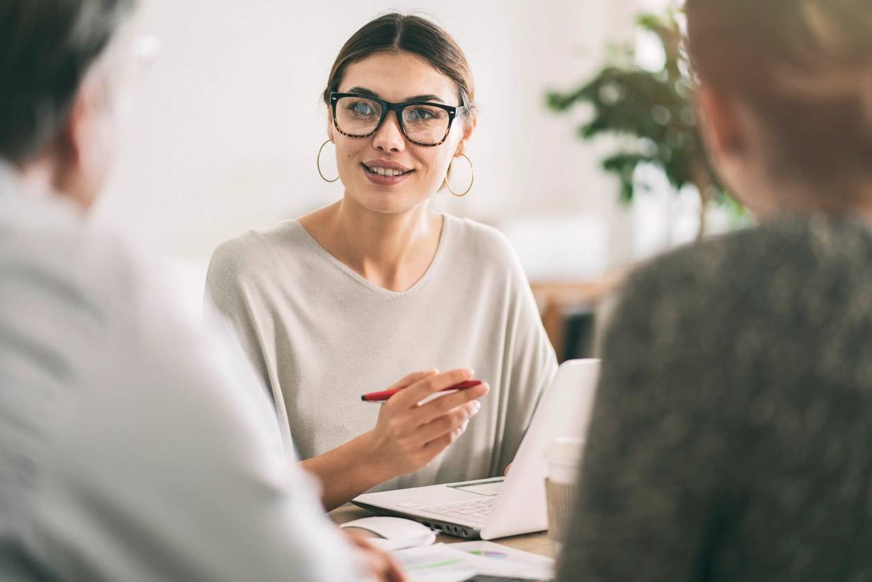 Real estate agent discussing with clients